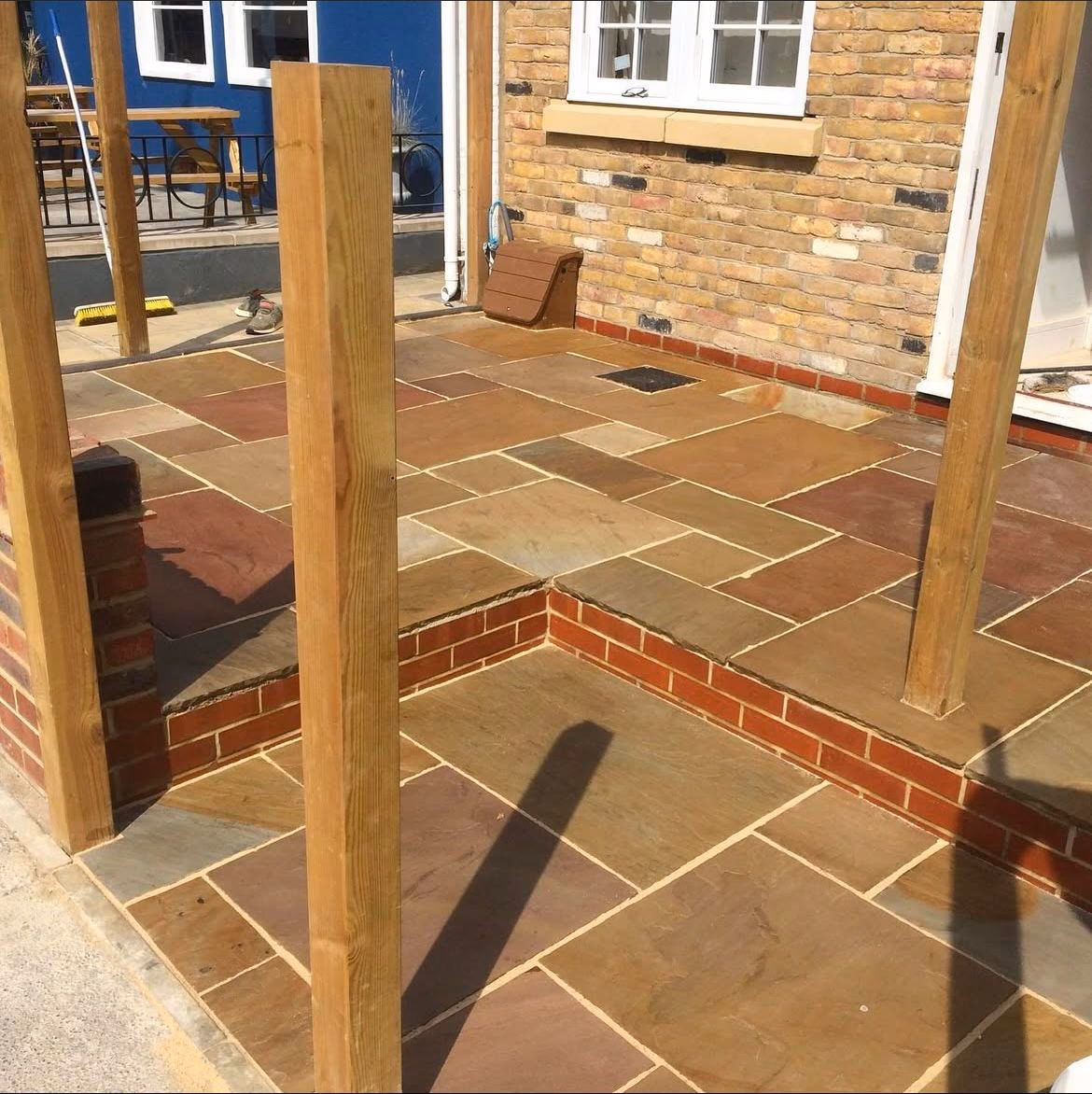 Sandstone patio with brick edging (3)